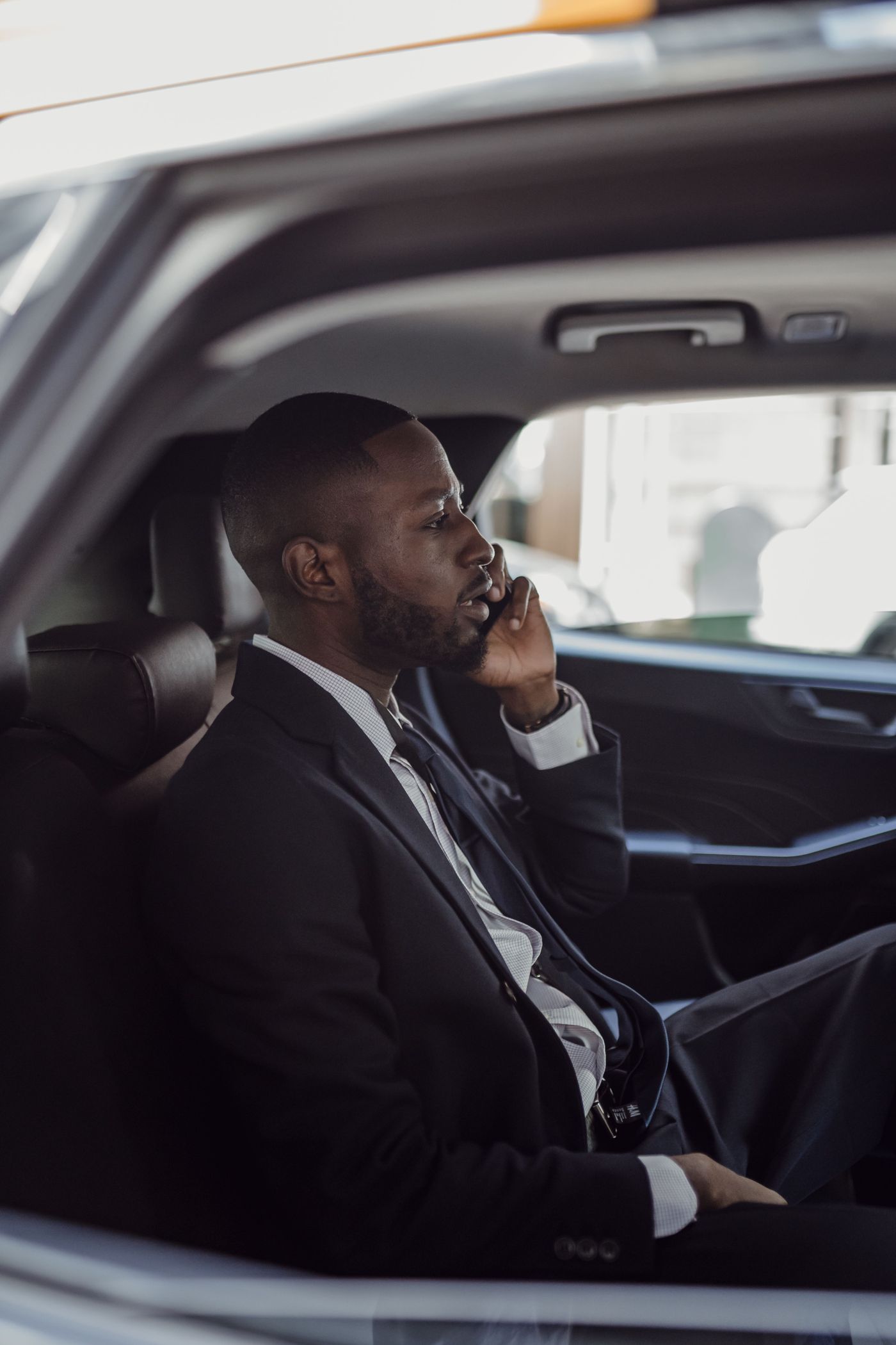 A professional driver on a call while in his vehicle